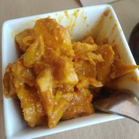 Tapa de patatas cocidas y "pollo" con salsa at La Huella Vegana in Rivas-vaciamadrid