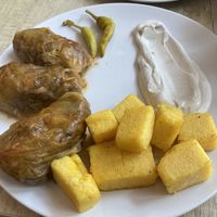 Cabbage with vegan homemade meat, polenta and cream (vegan)  at Vyro Raw & Vegan Bistro in Bucharest