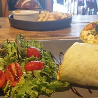 The scrambled tofu wrap and the pretzel breakfast roll ❤️❤️❤️❤️❤️ at Super Natural Newcastle in Newcastle Upon Tyne