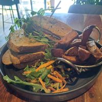 Vegan 'Chikn' sandwich with chips and salad. at Super Natural Newcastle in Newcastle Upon Tyne