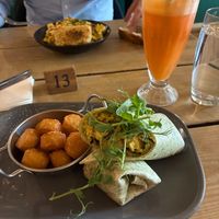 The Breakfast Wrap with a fresh juice (Super Boost Energy Drink (carrot, apple, ginger & lime)) from the Brunch Menu at Super Natural Newcastle in Newcastle Upon Tyne