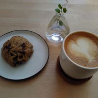 Cranberry chocolatechip cookie and oatmilk cappuchino. at El Fant in Helsinki