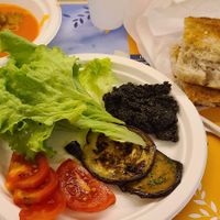 Supper - fresh baked bread,  olive spread, tomatoes,  zucchini and lettuce for sandwich.  Tomato soup. at Villa Aurora College Cafeteria in Florence