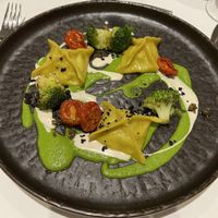 Ravioli with zucchini and ricotta, dried black olive shavings, roasted capers  at La Vimea - Vegan Hotel & Vegan Restaurant in Naturno