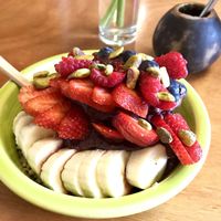 Full Size açaí bowl w added strawberries blueberries and pistachios! at Carioca Bowls in Portland
