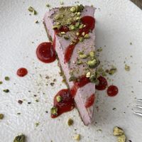 Strawberry cheesecake with pistachios   at Gioia Plant-Based Cuisine in Marbella