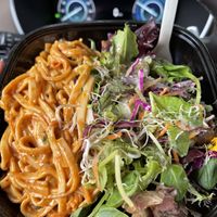 “Popular Choice” Salad topped with their peanut like noodles   at Macro Mamas in Ithaca