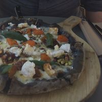 Black pizza  at The Green Spot in Barcelona