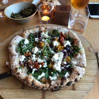 Vegetarian pizza, vegan sweet potato pasta and vegan kale chips  at The Green Spot in Barcelona