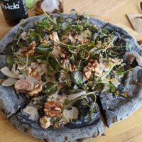 Pizza with walnuts and vegan blue cheese at The Green Spot in Barcelona