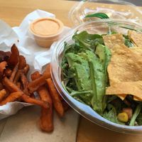 Sweet potato fries and arugula taco salad at HipCityVeg - 7th St in Washington
