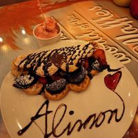 Vegan waffle with dark chocolate sauce, strawberries, Oreos. Side of vegan raspberry ice cream   at Wonder Waffel in Berlin