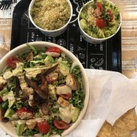 Kale Artichoke dip with chips, pesto pasta and kale Caesar salad  at By Chloe in Los Angeles