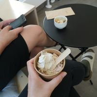 A cashew soft serve with roasted white chocolate and in the background a affogatto (an espresso shot poured on top of the ice cream) at Minù in Lund