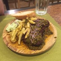 Home made seitan chorizo with chimichurri sauce, French fries and vegan aioli at Yanten Veggie Bar in Madrid