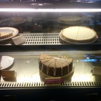 Dessert case. Raw pies, strawberry & coconut, chocolate mousse cake at Shangri-La Vegan - Telegraph in Oakland