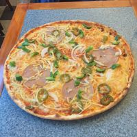 Massive pizzas  at Kungsholmens Pizza & Deli in Stockholm