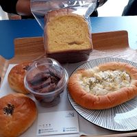 Red bean bun, pumpkin loaf, choc cookies and onion mayo bread. at Haemil Bakery in Seoul