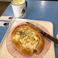matcha latte and onion and cheese bread? i think  at Haemil Bakery in Seoul