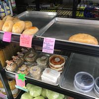 Reverie Kolache, empanada, cheese biscuit and chocolate peanut butter cups, and Goats Revolt cheeses at Farmers Market of Grapevine in Grapevine