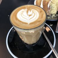Oat milk latte & coconut raspberry cake at The Plant Room in Brighton