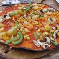tarte flambée with tomato sauce & vegetables (vegan) at Die Kartoffel in Saarbrucken