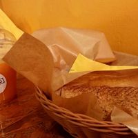 Orange juice and small flat bread with pineapple and avocado. at Mango Vegan Street Food - Zlota in Warsaw