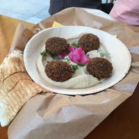 Hummus with falafel and pita  at Mango Vegan Street Food - Zlota in Warsaw