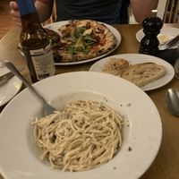 Vegan carbonara, pizza and garlic bread! Portions were large!  at Amici Ristorante in Keighley