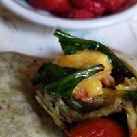 Small dish cut fresh fruit with some dishes at The Green Fork & Local Roots Market in North Wales