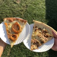 Onion ring (left) and Reuben (right) slices from Screamer’s at NYC Vegandale Festival  at Screamer's Pizzeria - Greenpoint in Brooklyn
