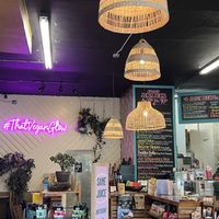 Cute inside with a vegan grocery section   at Glowing Plant Based Eatery in Los Angeles