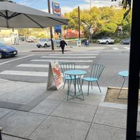 Cute seating outside with a few tables  at Glowing Plant Based Eatery in Los Angeles