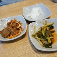 Side dishes. Acorn jelly and pickled radish are vegan, greens have a seafood in them at MeMilGongBang - Gangnam - 메밀공방 강남역점 in Seoul