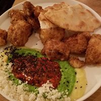 Cauliflower	purée,	green	pea	purée with	cauliflower	tempura,
naan	bread	&	harissa at Meatless District - Da Costabuurt in Amsterdam