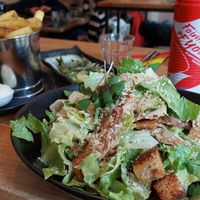 Caesar salad with a side of fries and asparagus at Meatless District - Da Costabuurt in Amsterdam
