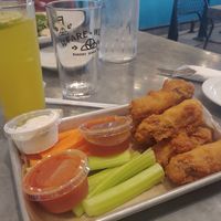 Wings with sauces and Turmeric mocktail at Sticky Fingers Diner in Washington
