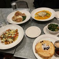 Clockwise --> Blueberry pancakes,  Chilaquiles, Pierogies, Curry, Side of chard at Sticky Fingers Diner in Washington