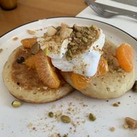 Amazing home made mandarin crumpets with coco yoghurt! at Grace in Fitzroy