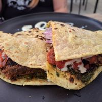 Hamburguesa de lentejas en chapati $25.90 soles at Sattva by Govinda in Aguas Calientes