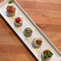 Staffed mushrooms with walnut meat, olive pate, pesto basil, tomato salsa, cashew mayo at Bistraw Zdravo Zivo in Skopje