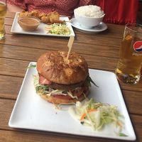 Vegan bacon burger and vegan skewers with peanut sauce at Papa No in Berlin