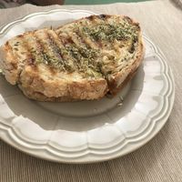 Tosta de queijo, tomate e oregãos at Green Beans in Lisbon