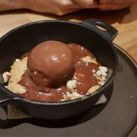 Cookie dough cake served with vegan icecream and choc sauce 😍 at Armonica Cafe in Lima