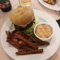 Seitan burger with fries at Terapija in Riga