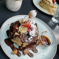 Pancakes with Chocolate Sirup, Fruits, Granola and Maple Sirup at Emmi's Kitchen - Glockenbach in Munich