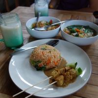 Counter clockwise starting at the front: nasi goreng with satay, noodle soup, gado gado and banana juice at Bali Maitreya Cafe in Lembongan
