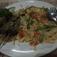 Fried noodles with "chicken" satay. at Bali Maitreya Cafe in Lembongan