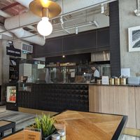 Three long bench tables provide interior seating at Virtuous Pie  in Vancouver