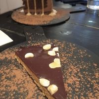 The peanut butter cake wasn't amazing, but the one behind was the best😍 (the tall cake, we don't remember what it was besides chocolate) at 26 Vegan Food Project in Lisbon